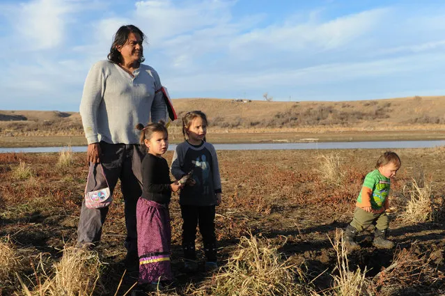 A family from the Cheyenne River tribe plays together near Turtle Island during a protest against plans to pass the Dakota Access pipeline near the Standing Rock Indian Reservation, near Cannon Ball, North Dakota, U.S. November 26, 2016. (Photo by Stephanie Keith/Reuters)