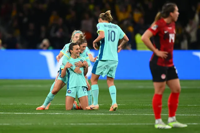 Hayley Raso of Australia celebrates with teammates after scoring her team's first goal during the FIFA Women's World Cup Australia & New Zealand 2023 Group B match between Canada and Australia at Melbourne Rectangular Stadium on July 31, 2023 in Melbourne, Australia. (Photo by Morgan Hancock/Rex Features/Shutterstock)