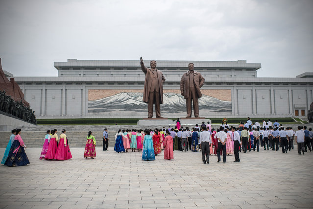 North Koreans pay their respects to the Mansudae Grand Monument, huge statues of Kim Il-sung and Kim Jong-il, on August 19, 2018 in Pyongyang, North Korea. (Photo by Carl Court/Getty Images)
