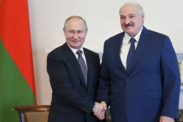Russian President Vladimir Putin, left, and Belarusian President Alexander Lukashenko pose for a photo during their meeting in St. Petersburg, Russia, Tuesday, July 13, 2021. Putin has hosted the leader of Belarus, who has increasingly relied on Moscow's support amid increasing tensions with the West. Belarus' authoritarian President Alexander Lukashenko thanked Putin for a “very serious support from Russia” and pledged that his country will duly repay its loans. (Photo by Alexei Nikolsky, Sputnik, Kremlin Pool Photo via AP Photo)