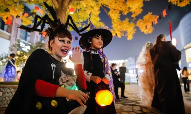 People in costumes attend an event during a Halloween celebration at Solana shopping mall, in Beijing, China, 31 October 2023. Halloween is celebrated on 31 October and every year is getting more popular among Chinese people. (Photo by Wu Hao/EPA/EFE)