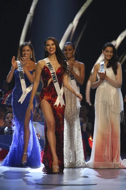 Miss Philippines Catriona Gray, second from left, walks on the stage during the final of 67th Miss Universe competition in Bangkok, Thailand, Monday, December 17, 2018. (Photo by Gemunu Amarasinghe/AP Photo)