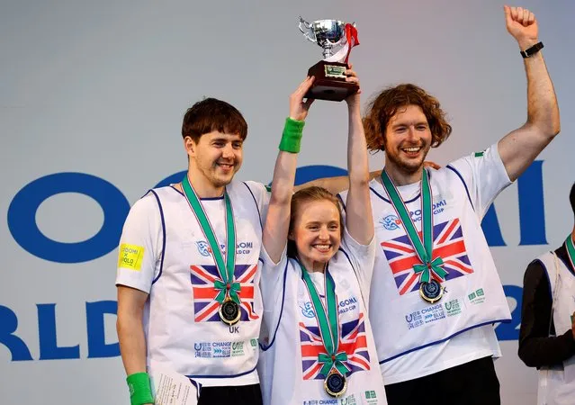 Members of team UK pose with their victory trophy at an award ceremony during a trash picking competition known as “Spogomi World Cup” in Tokyo, Japan on November 22, 2023. (Photo by Kim Kyung-Hoon/Reuters)