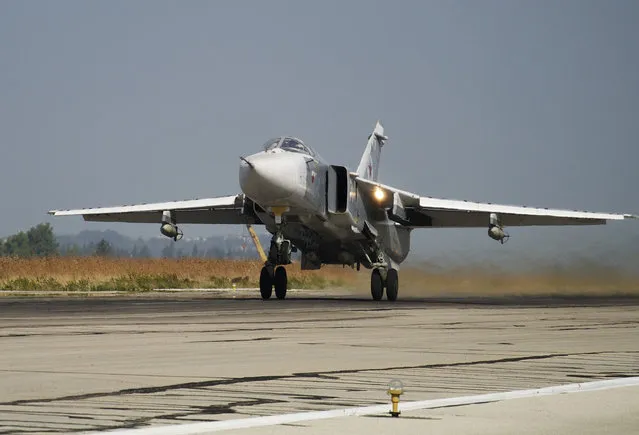 In this October 22, 2015 file photo, a Russian Su-24 takes off on a combat mission at Hemeimeem airbase in Syria. The Russian military says its warship has fired warning shots and a warplane dropped bombs to force a British destroyer from Russia's waters near Crimea in the Black Sea. The incident on Wednesday June 23, 2021, marks the first time since the Cold War era when Moscow used live ammunition to deter a NATO warship, reflecting soaring Russia-West tensions. (Photo by Vladimir Isachenkov/AP Photo/File)
