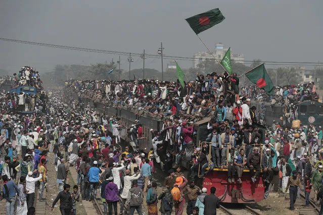 Bangladeshi Muslim devotees head to their homes in an over-crowded train after attending the final day of a three-day Islamic congregation on the banks of the River Turag in Tongi, about 20 kilometers (13 miles) north of the capital Dhaka, Bangladesh, Sunday, January 15, 2017. Since the 1960s, devotees have been participating in the annual event, which is one of the world's largest congregations of Muslims, the second phase of which is scheduled to begin Friday. (Photo by AP Photo)