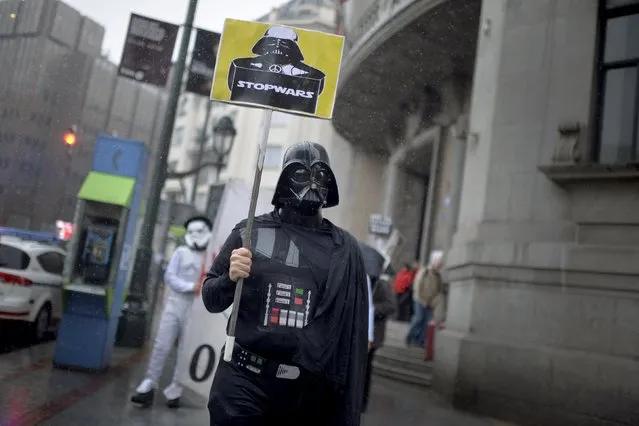 Protesters dressed as Darth Vader and stormtrooper from the film series Star Wars take part in a demonstration against military spending and in favour of aid for refugees ahead of the thirtieth anniversary of the referendum on Spain's membership in NATO, in Bilbao, northern Spain March 9, 2016. (Photo by Vincent West/Reuters)