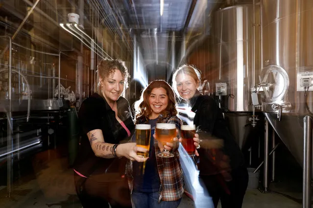 Pink Boots Society members Sarah Triss, Lia Garcia and Lauren Constantiner, a group of females working in the brewing industry, celebrate International Women's Day with a women's branded beer at Societe Brewing in San Diego, California, U.S., March 8, 2019. (Photo by Mike Blake/Reuters)