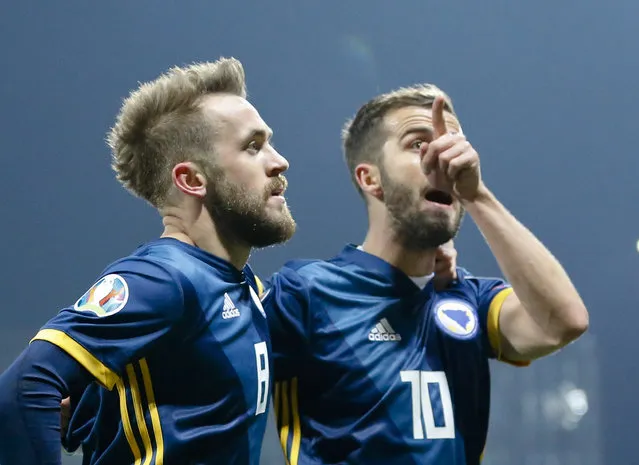 Bosnia's Edin Visca, left, celebrates after scoring his side's first goal together with Bosnia's Miralem Pjanic during the Euro 2020 group J qualifying soccer match between Bosnia-Herzegovina and Greece in Zenica, Bosnia, Tuesday, March 26, 2019. (Photo by Darko Bandic/AP Photo)