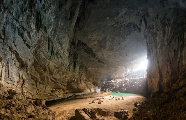 The campers set up inside the cave on the beach. (Photo by Lars Krux/Caters News)