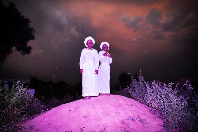 Two women stand on a mound before a church service in Igbo-Ora, Nigeria. (Photo by Bénédicte Kurzen/Noor and Sanne de Wilde/World Press Photo 2019)