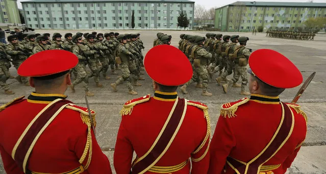 Georgian soldiers march at the military base of Vaziani outside Tbilisi during a farewell ceremony marking their departure to Afghanistan, in Tbilisi, Georgia, 24 March 2016. Georgian soldiers will take part in the NATO peace support mission in Afghanistan. (Photo by Zurab Kurtsikidze/EPA)