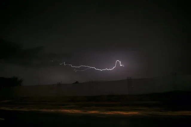 A Lightning lights up the sky over central Gaza strip during a storm in Gaza Strip, 20 November 2021. (Photo by Mohammed Saber/EPA/EFE)