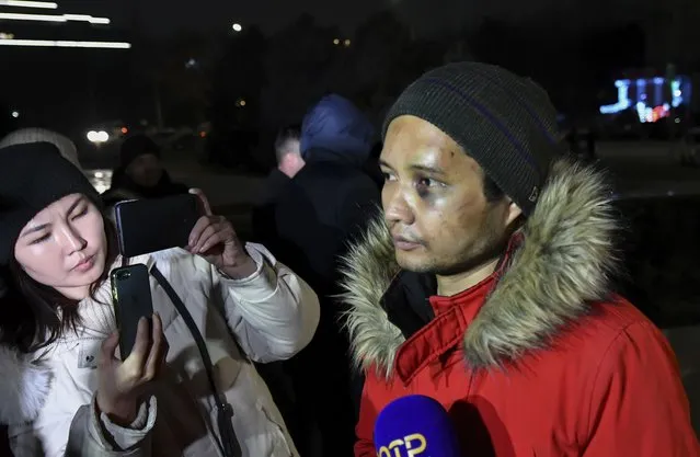 Kyrgyz musician Vikram Ruzakhunov, right, speaks to the media in Bishkek, Kyrgyzstan, January 10, 2022. Ruzakhunov was arrested in Kazakhstan amid unrest there and authorities in Kyrgyzstan demanded his release. Ruzakhnunov appeared in a video on Kazakh television and said he had joined the protests, but he later told a Kyrgyz broadcaster that while in jail, his cellmates said the quickest way to get released was to confess to a false story, so that’s what he did. (Photo by Vladimir Voronin/AP Photo)