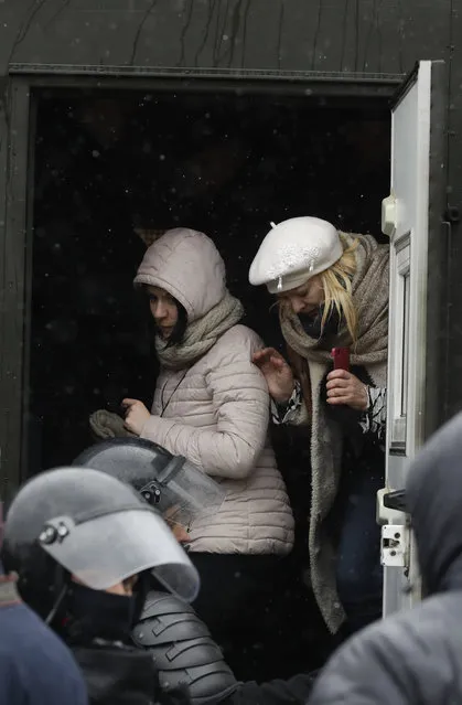 Two women are detained by police during an opposition rally in Minsk, Belarus, Saturday, March 25, 2017. (Photo by Sergei Grits/AP Photo)