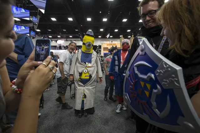 A cosplay enthusiast dressed like a Minion character walks the floor during the 2015 Comic-Con International Convention in San Diego, California July 10, 2015. (Photo by Mario Anzuoni/Reuters)