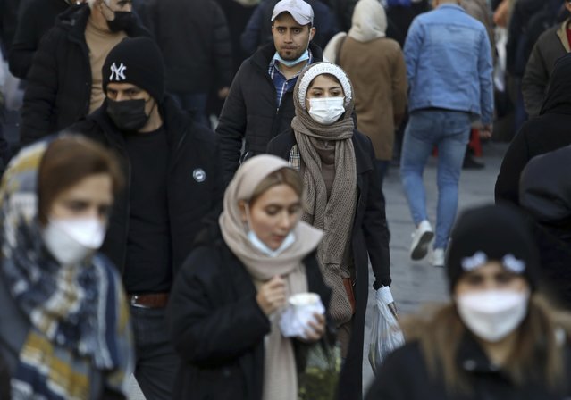 People visit the Grand Bazaar of Tehran, Iran, Saturday, January 22, 2022. (Photo by Vahid Salemi/AP Photo)