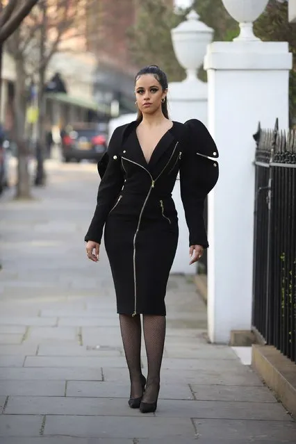 Cuban-American singer-songwriter Camila Cabello is seen wearing black Moschino dress with zipper, Saint Laurent heels, net tights on March 25, 2022 in London, England. (Photo by Christian Vierig/GC Images)