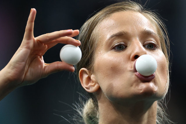 A volunteer performs with a table tennis ball before the bronze-medal match between Hina Hayata of Japan and Yubin Shin of South Korea at South Paris Arena 4 in Paris, France on August 03, 2024, (Photo by Stéphanie Lecocq/Reuters)