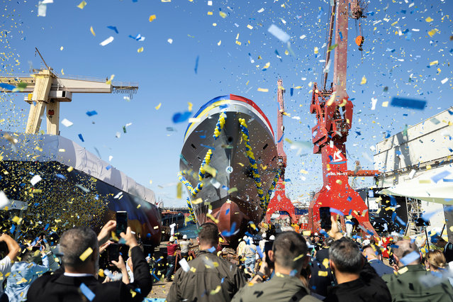 This handout photograph by Ukrainian Presidential Press Service released on August 2, 2024, shows the launching ceremony of the Ada class corvette “Hetman Ivan Vyhovskyi” in Istanbul on August 1, 2024, amid the Russian invasion of Ukraine. This vessel was constructed for the Ukrainian Navy at a shipyard in Turkey. (Photo by Ukrainian Presidential Press Service/Handout via AFP Photo)