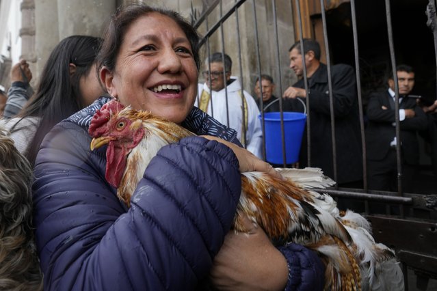 Pucho and its caretake are sprinkled with holy water during a Blessing of the Animals service at San Francisco Church in Quito, Ecuador, Friday, October 4, 2024, the feast day of St. Francis of Assisi. (Photo by Dolores Ochoa/AP Photo)