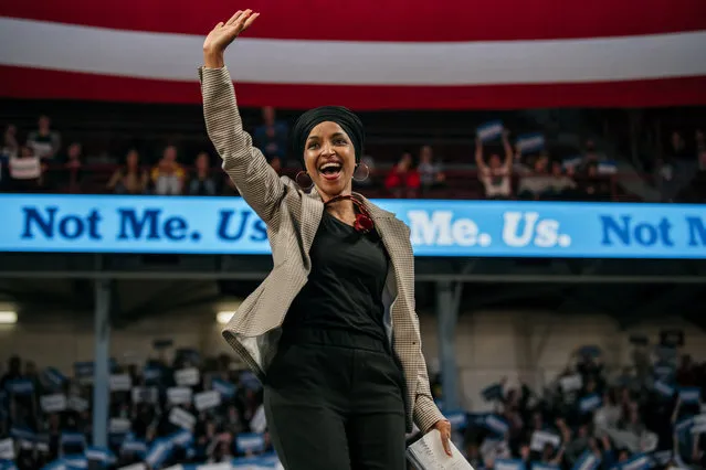 Representative Ilhan Omar (D-MN) waves to the crowd at a campaign rally for Senator (I-VT) and presidential candidate Bernie Sanders at the University of Minnesotas Williams Arena on November, 3, 2019 in Minneapolis, Minnesota. Before introducing him, Rep. Omar praised Sanders for his support of unions, comprehensive immigration reform, and support for refugees. (Photo by Scott Heins/Getty Images)