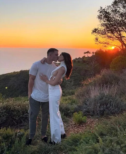 American fashion influencer, social media personality and actress Olivia Culpo and American football running back Christian McCaffrey celebrate their third anniversary with a kiss at sunset in the last decade of June 2022. (Photo by oliviaculpo/Instagram)