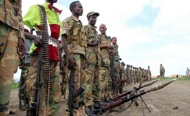 Jubbaland forces stand with their ammunitions as they prepare for a security patrol against Islamist al Shabaab militants in Bulagaduud town, north of Kismayu, Somalia, August 17, 2015. Ahmed Madobe, a former Islamist warlord won re-election on Saturday as president of Somalia's southern region of Jubbaland, a territory partly controlled by al Shabaab militants and at odds with the central government of the Horn of Africa country. (Photo by Abdiqani Hassan/Reuters)