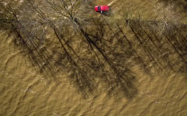 A car is surrounded by water as floodwaters persist in the centre of Worcester City after the River Severn burst its banks on February 27, 2020 in Worcester, England. Flooding levels are decreasing after storms Ciara and Dennis, however forecasters are predicting more rain and 70mph winds this weekend from storm Jorge. (Photo by Christopher Furlong/Getty Images)