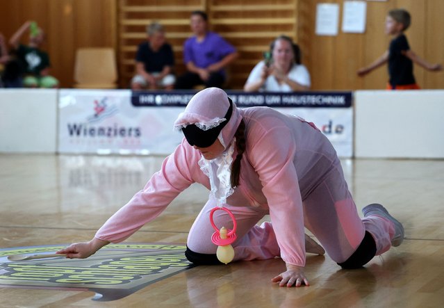 A participant takes part in the first pot hitting (Topfschlagen) World Championships in Lindheim near Frankfurt, Germany on September 9, 2023. (Photo by Kai Pfaffenbach/Reuters)