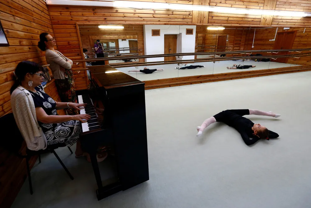 Gymnasts Stretch for Success