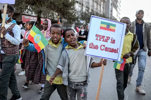 Ethiopians protest at a rally organized by the city administration against what they say is interference by outsiders in the country's internal affairs and against the Tigray People's Liberation Front (TPLF), the party of Tigray's fugitive leaders, in the capital Addis Ababa, Ethiopia Saturday, October 22, 2022. The demonstrations were staged ahead of the expected start of peace talks in South Africa next week between the warring parties, with the U.S. saying Friday it supports the African Union's efforts to mediate talks to stop fighting in Tigray. (Photo by AP Photo/Stringer)