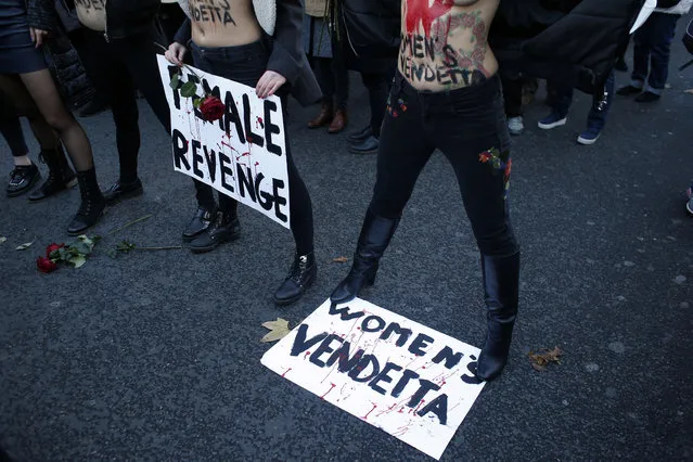 Femen activists attend a demonstration for the International Day for the Elimination of Violence against Women, in Paris, Saturday, November 25, 2017. (Photo by Thibault Camus/AP Photo)