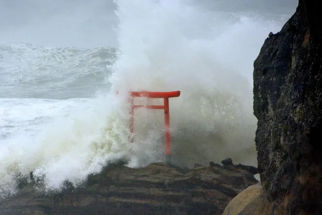 High waves triggered by Typhoon Lionrock crash against a “torii” gate on a coast of the city of Iwaki in Fukushima Prefecture on August 30, 2016. The Japanese Meteorological Agency said the powerful typhoon is expected to make landfall in northeastern Japan later in the day. (Photo by Kyodo News via AP Images)