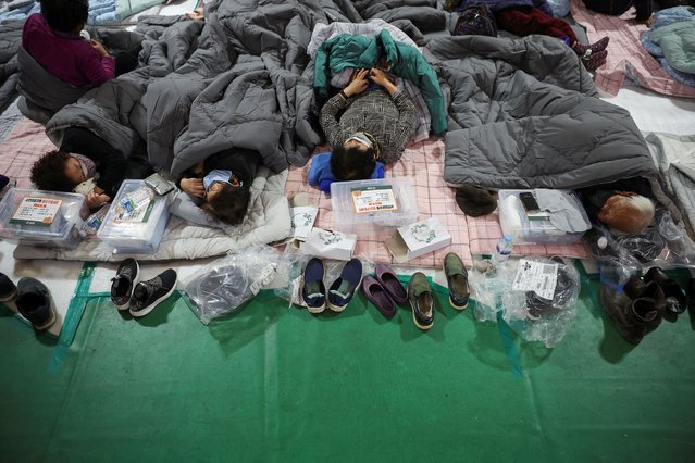 People rest at a shelter as a wildfire devastates the area, in Yeongyang, South Korea on March 26, 2025. (Photo by Kim Hong-Ji/Reuters)