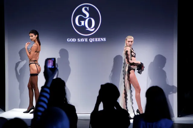 Attendees watch as models present creations from God Save Queens Spring/Summer 2017 collection during New York Fashion Week in the Manhattan borough of New York, U.S., September 7, 2016. (Photo by Lucas Jackson/Reuters)