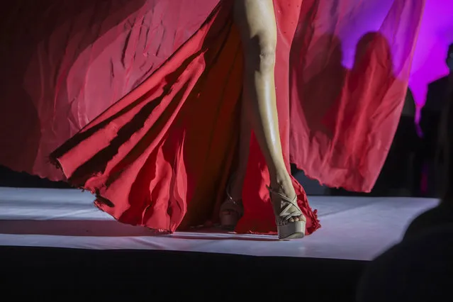 Contestant Geyssell Garcia from de department of Chontales, walks the catwalk during the Miss Nicaragua in Managua, Nicaragua, Saturday, August 8, 2020. The limited audience consisted of two people per contestant spaced safely, plus a production crew of 85. The masks were off the contestants, but the judges wore them and were spaced at a safe distance. (Photo by Alfredo Zuniga/AP Photo)