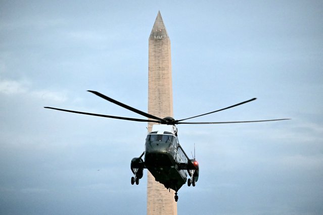 US President Donald Trump on board Marine One approaches the South Lawn of the White House in Washington, DC, on May 22, 2025. Trump attended a private dinner at Trump National Golf Club. (Photo by Mandel Ngan/AFP Photo)
