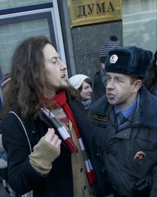 Orthodox activists clashes with a gay rights campaigner during a protest outside of the State Duma, Russian Parliament's lower chamber, in downtown Moscow, January 22, 2013. (Photo by Ilya Pitalev/RIA Novosti)