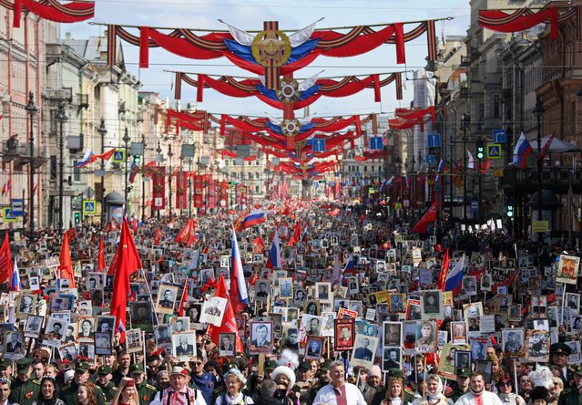 Participants carry portraits of people, including Red Army soldiers and veterans, during the Immortal Regiment march on Victory Day, marking the 80th anniversary of the victory over Nazi Germany in World War Two, in Saint Petersburg, Russia, on May 9, 2025. (Photo by Anastasia Barashkova/Reuters)