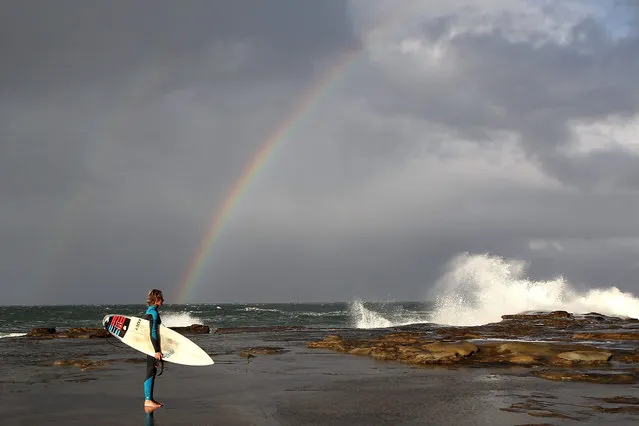 A surfer about to enter the water at Terrigal on the New South Wales Central Coast on September 23, 2015 in Sydney, Australia. (Photo by Tony Feder/Getty Images)