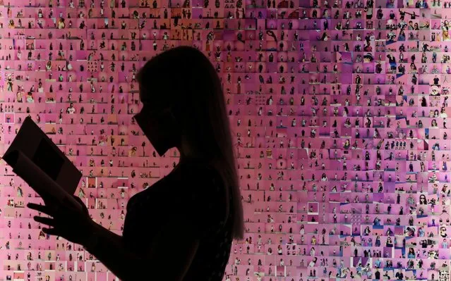 A visitor views a work titled “Murmurations #23: 10,000 selfies (with a pink wall in Los Angeles)” by artist Stephanie Potter Corwin, that forms part of the Aesthetica Art Prize exhibition on show at York Art Gallery in Yorkshire on August 13, 2020. (Photo by Nigel Roddis/LNP)