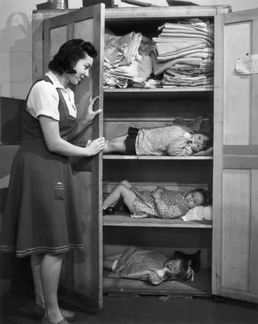 A day nursery in the East End of London, where the children shelter in a linen cupboard during an air raid, circa 40s. (Photo by Keystone Features/Getty Images)
