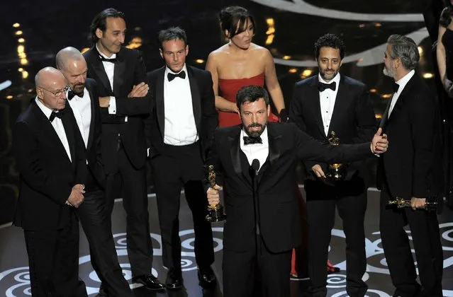Director/producer Ben Affleck accepts the award for best picture for “Argo” as the cast and crew look on. (Photo by Chris Pizzello/Invision)