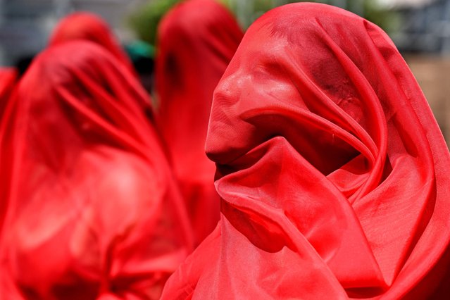 Demonstrators take part in a march to mark the International Women's Day in San Salvador, on March 9, 2024. (Photo by Marvin Recinos/AFP Photo)