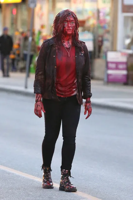 Katherine Langford on set filming her new movie “Spontaneous” in Vancouver, Canada on February 20, 2018. In the scene Katherine Langford character is covered in blood while walking down the street. (Photo by Splash News and Pictures)