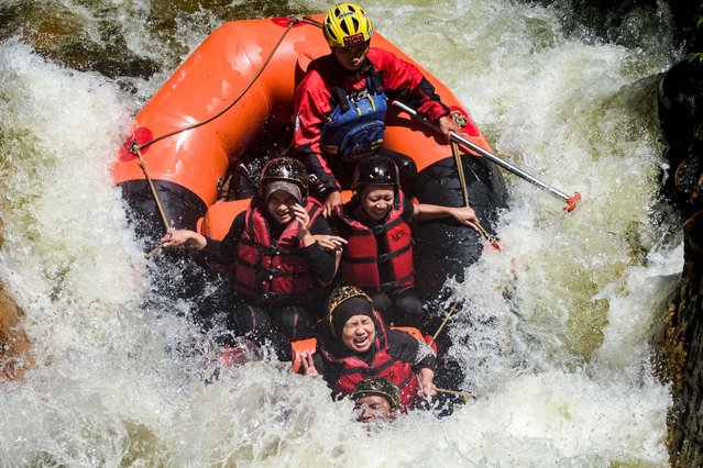 Local tourists enjoy white water rafting across river Palayangan in the Pangalengan district of Bandung, West Java on June 8, 2025. (Photo by Timur Matahari/AFP Photo)