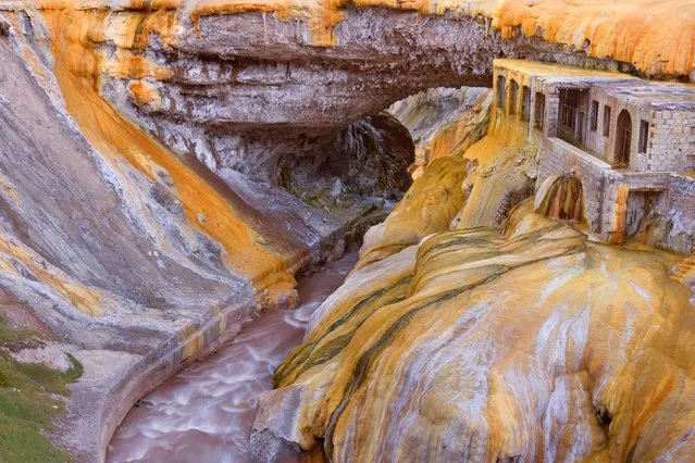 The Puente del Inca natural rock bridge in Argentina – Bright orange and yellow bacteria mats are created by natural sulphur springs which cover the rock walls. (Photo by Steffen And Alexandra Sailer/Ardea/Caters News)