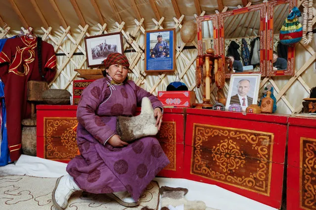 Tanzurun Darisyu, 51, supporter of presidential candidate Vladimir Putin and head of a private farm located in Kara-Charyaa area in the south of Kyzyl town, the administrative centre of the Republic of Tyva (Tuva region), poses for a picture inside her yurt in Southern Siberia, Russia, February 14, 2018. “We, the Arat people, farmers, need to be able to be confident about what tomorrow will look like. We need this in order to expand and develop our farmsteads”. said Darisyu. (Photo by Ilya Naymushin/Reuters)