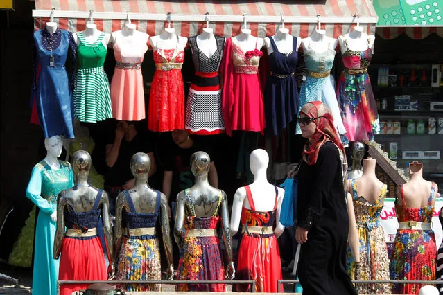 A woman walks near mannequins in Palestinian Sabra and Shatila refugee camps, Lebanon September 16, 2016. (Photo by Aziz Taher/Reuters)