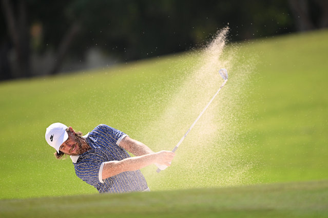Tommy Fleetwood of England plays his second shot on the third hole from a bunker on day four of the DP World Tour Championship 2025 at Jumeirah Golf Estates on November 16, 2025 in Dubai, United Arab Emirates. (Photo by Ross Kinnaird/Getty Images)